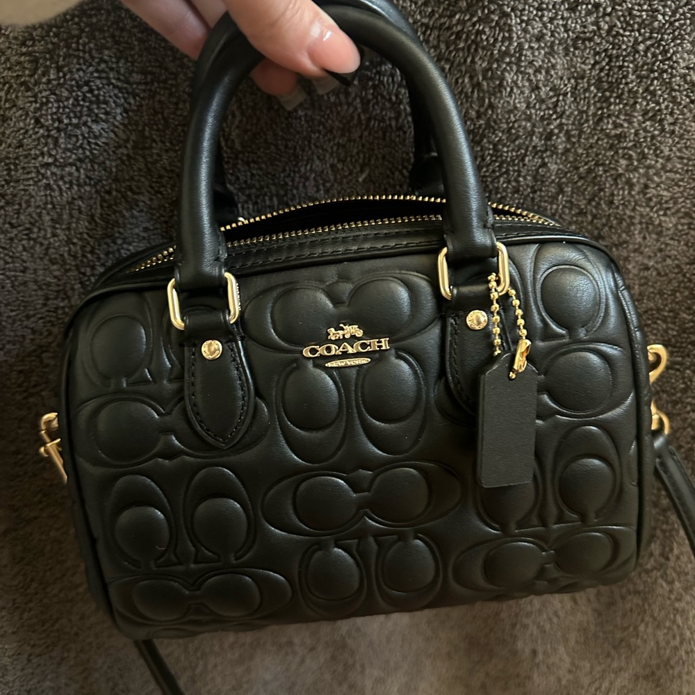 Brand new without tags black mini Rowan coach bag.